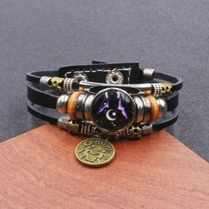Bracciale multistrato in pelle retrò con ciondolo Gemelli e cupola in vetro celeste luminoso