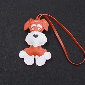 Handmade orange Schnauzer puppy leather keychain and cute bag charm with white stitching