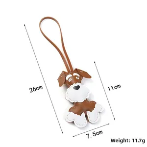 Close-up of handmade brown Schnauzer puppy bag charm showing weight and dimensions