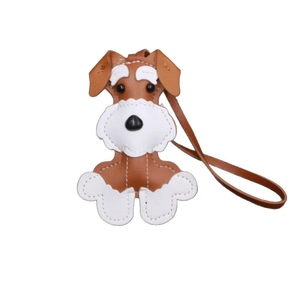 Handmade leather Schnauzer dog keychain pendant with brown and white stitching detail