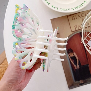 Large butterfly hair claw clip with colorful marble pattern and gold metal spring for women