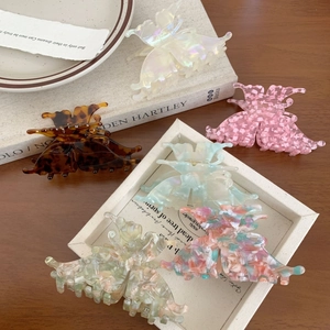 Elegant butterfly hair claws in acetate finish with diverse patterns for women's styling