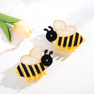 Detail view of acetic acid bee hair claws with crystal accents and pearlescent wings