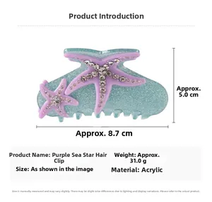 Detailed view of blue acrylic starfish hair claw clip with glitter and purple rhinestones