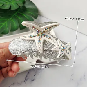 Elegant starfish shark hair clip with sparkling rhinestones and silver finish, 8.7cm length