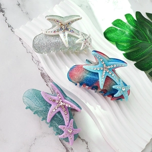 Elegant rhinestone starfish hair claw clips in assorted glitter colors for styling