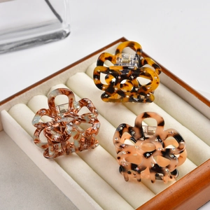 Three-piece acetate flower hair claws with leopard pattern and rhinestone accents