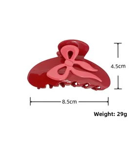 Détail de la pince à cheveux nœud rouge et rose de 8,5 cm avec spécification de 29 g