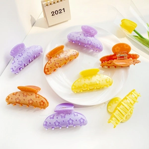 Lot de trois pinces à cheveux fleurs en acétate mat violet orange et jaune pour femmes