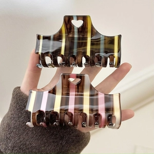 Retro plaid acetate hair claw clips with heart cutout detail for bun hairstyles