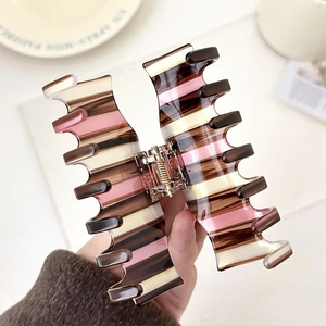 Large pink and brown vintage checkered acetate hair claw clip for elegant bun hairstyles