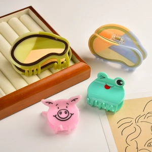 Cute avocado and animal-shaped acetate hair claws including pink pig and green frog designs