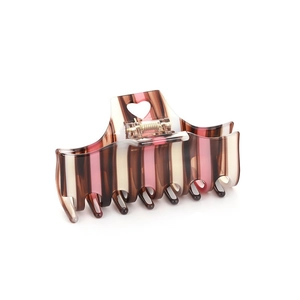 Pink and brown striped acetate claw clip with heart cutout in 45-degree view
