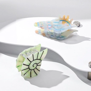 Acetic acid hair claw clip with ocean seashell and nautilus designs in iridescent colors