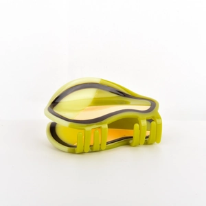 Cute avocado-shaped hair claw clip in green and yellow acetate with a glossy finish