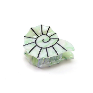 Chic nautilus shell hair claw in mint green marble pattern with black spiral details