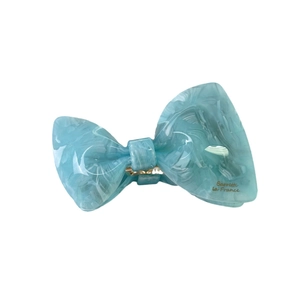 Elegant blue marble bow hair claw made of premium acetate with gold lettering detail