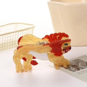 Cute acetate lion hair claw clip in amber marble pattern for elegant hairstyling