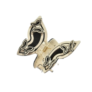 Eleganter Schmetterlings-Haarclip aus Acetat in Creme mit schwarzem Muster und Goldfeder