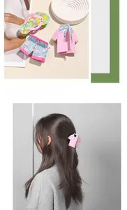 Detailed view of creative pink acetate hair clips featuring flip-flop and clothing shapes