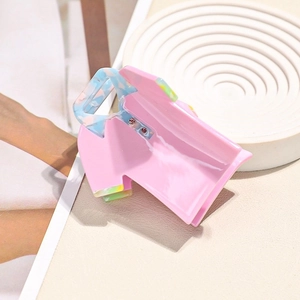 Pink shirt-shaped acetate hair claw clip with floral collar and smooth glossy finish