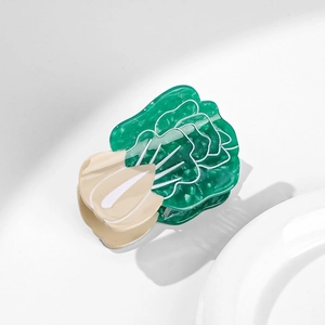 Detail of creative cabbage-shaped hair claw clip made of acetate with jade texture