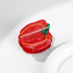 Creative red pepper bell pepper hair claw clip with green stem and marble texture detail