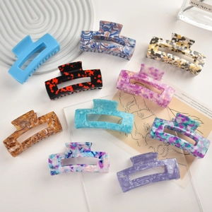 Set of large acetic acid hair claw clips in various marble and leopard patterns