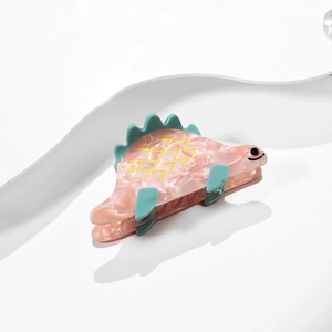 Pince à cheveux dinosaure en acétate marbré rose avec dos dentelé vert pour femmes