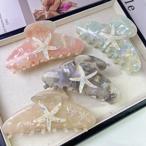 Starfish acetate hair claws in pastel marble colors for elegant updos and styling
