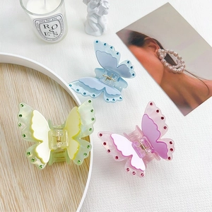 Three colorful butterfly hair claws with rhinestones and acetate finish for women
