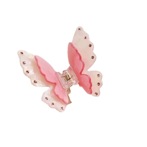 Elegant butterfly hair claw clip with rhinestones and pearl finish in pink and white