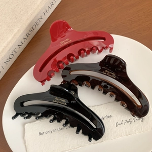 Three elegant French acetate hair claws in red, brown and black with gold lettering