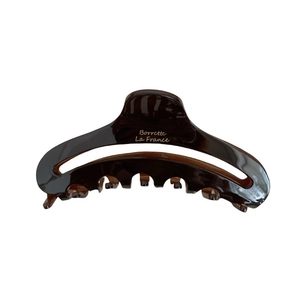 Elegant deep brown tortoiseshell acetate claw clip with gold France branding and hollow design