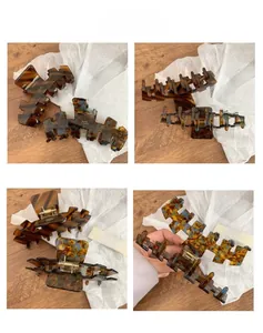 Detail view of large acetate claw clip with tortoiseshell and marble patterns