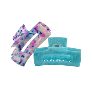 Rectangle acetate claw clips with marble pattern and light blue finish in top view