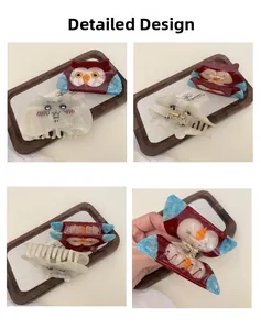 Detailed views of cartoon owl and cat acetate hair claws with sparkling glitter accents