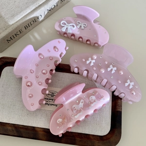 Elegant pink acetate hair claws with pearls, rhinestones and ribbon bow designs