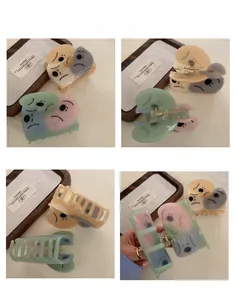 Detail view of acetate claw clip with funny face expression in four different angles