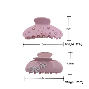 Size and weight detail for pink floral hair claws with pearls and rhinestones
