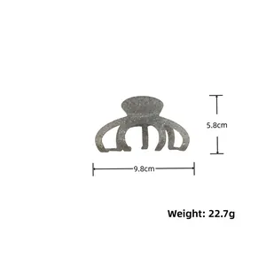 Detailed view showing the 9.8cm length and 5.8cm height of this grey terrazzo hair claw