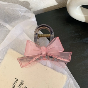 Detail of the pink mesh bow and semi-transparent grey hair claw clip for women