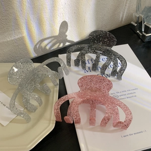 Sparkly glitter claw clips in silver, black and pink colors for elegant hairstyling
