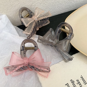 Sweet transparent bow hair claw clips in pink and grey for elegant hairstyling