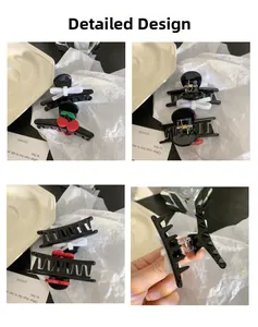 Vues détaillées de pinces à cheveux panda noires avec nœud et cerise sous plusieurs angles