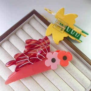Elegant acetate bee and flower claw clips in red and yellow for women's hair