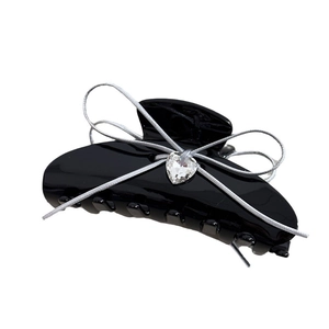Elegant black acetate hair claw clip with silver ribbon bow and crystal heart charm