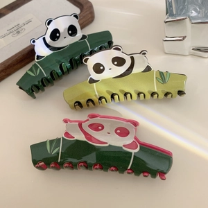 Three cute panda and bamboo shaped acetate hair claws in various shades of green