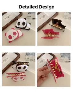 Detail showing cartoon panda hair claw clips with pink and black finish and metal teeth