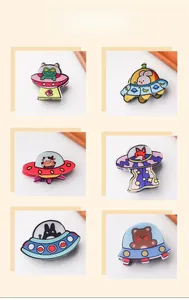 Close-up of cartoon alien hair claws in various UFO spaceship designs and colors